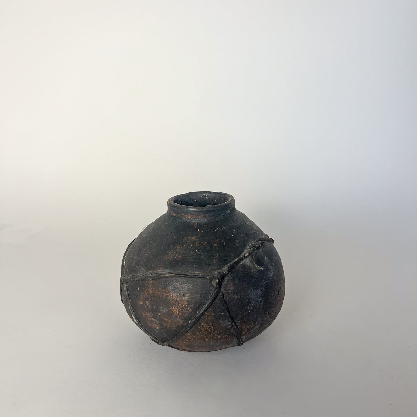 black terracotta vessel