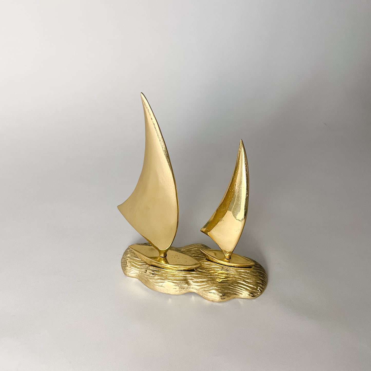brass boats on water